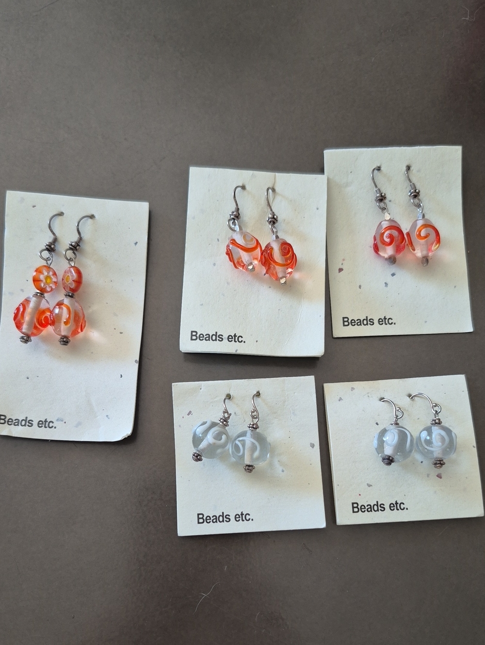 3. 🌸 2/$15 Assorted Orange And White Glass Drop Earrings With Swirls